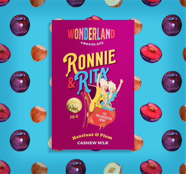plum and vegan hazelnut chocolate flavoured bar with hazelnuts and plum graphics in a blue background